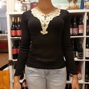 Black long-sleeved shirt with white lace V-collar